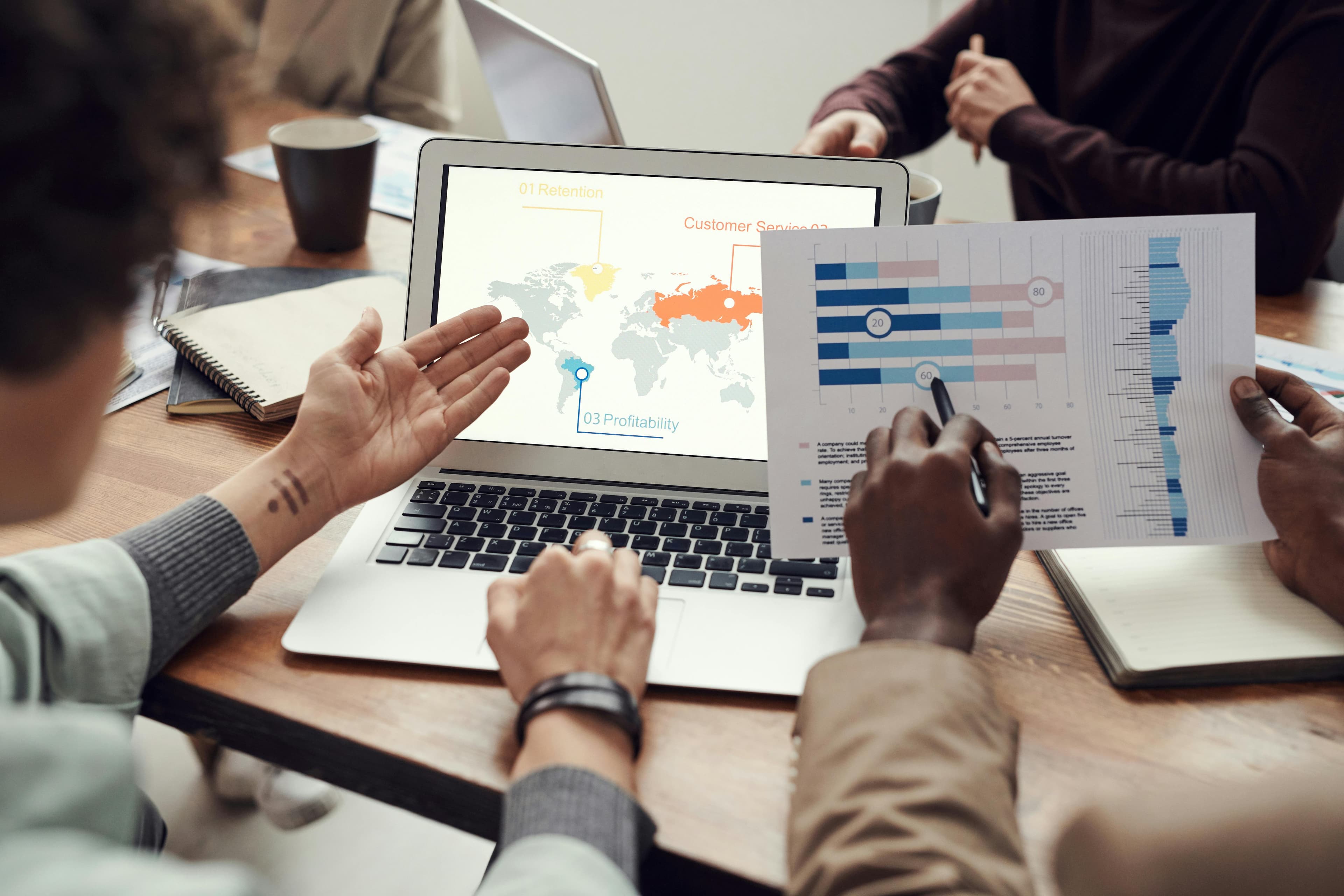 SEO professionals working with analysis tools in modern office environment