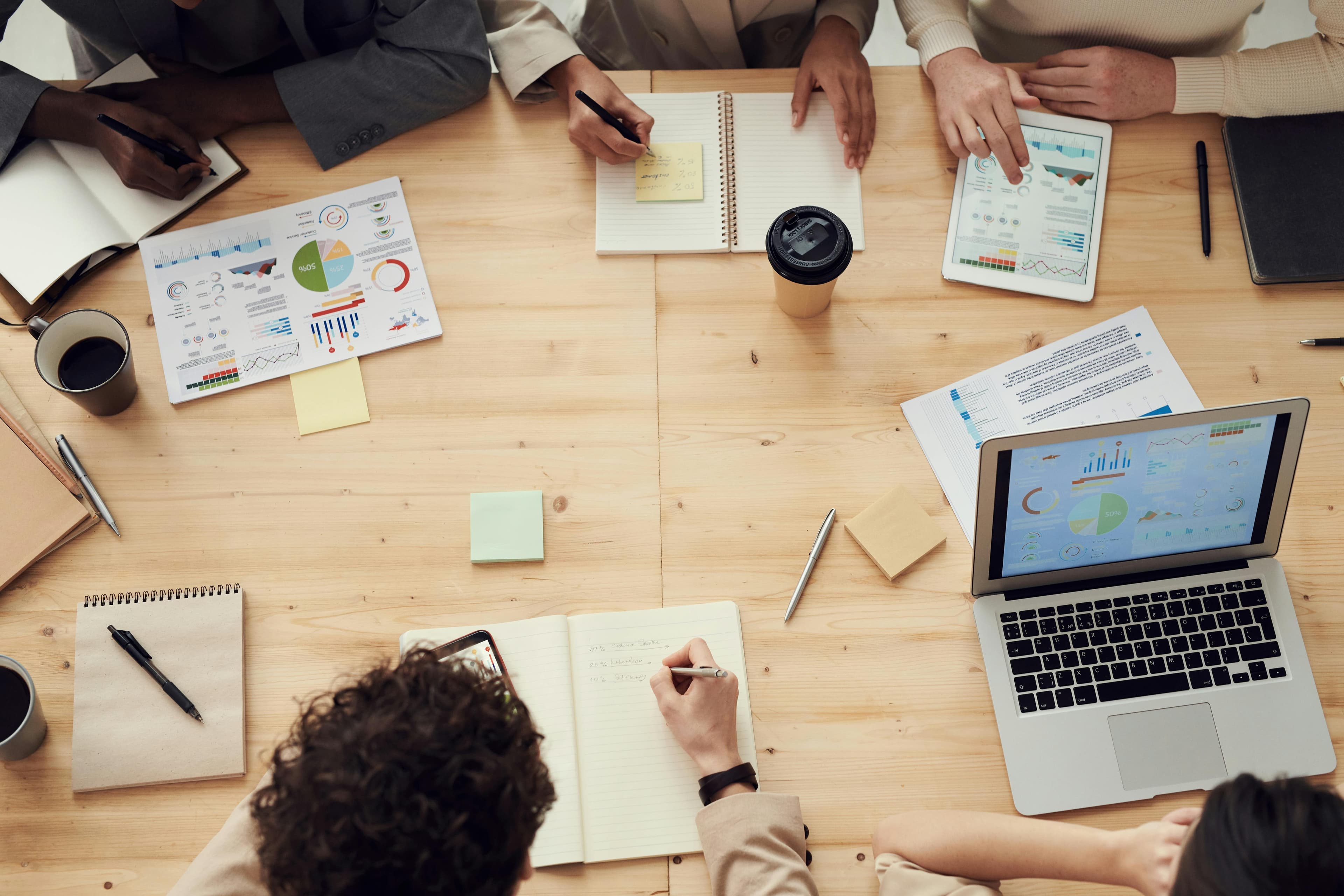 SEO professionals creating content and analyzing data in modern workspace environment