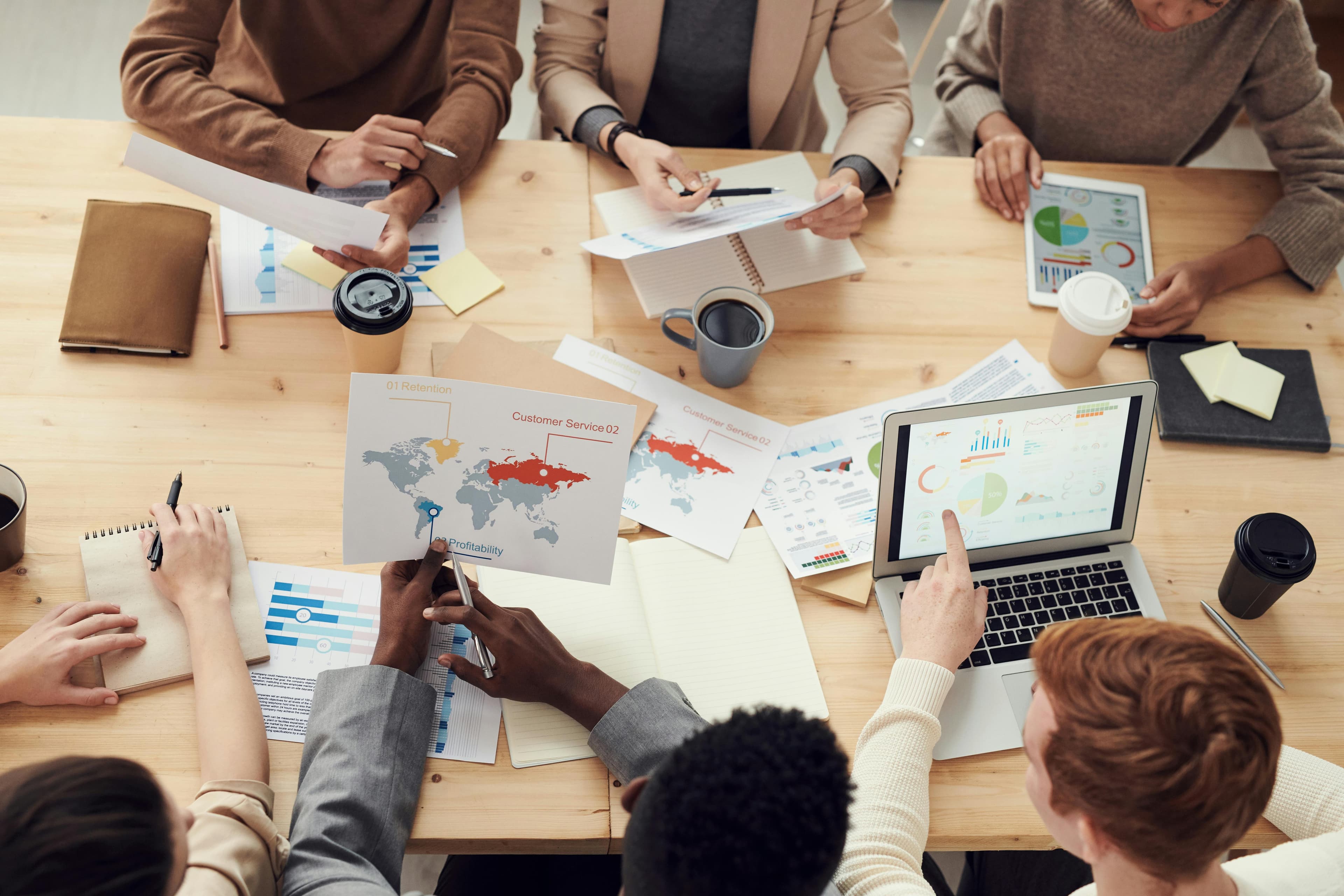 SEO professionals collaborating on digital marketing strategy in a modern office environment