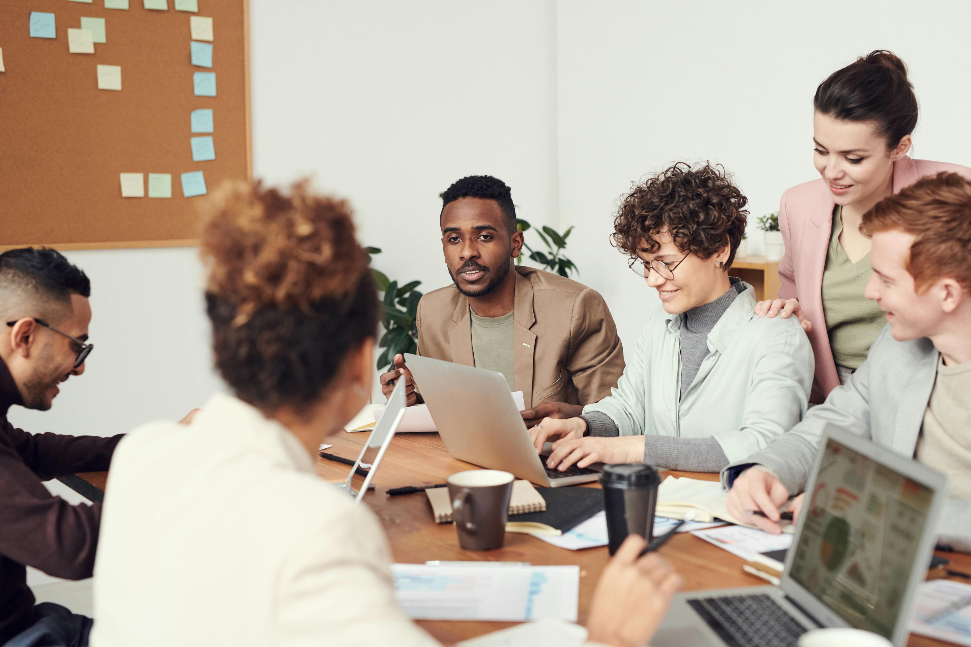 SEO professionals analyzing case studies and success metrics in collaborative workspace